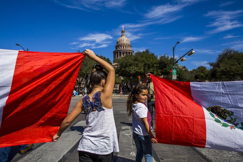 AUSTIN, TX - FEBRUARY 16: Protesters march in the streets outside the Texas State Capital on 'A Day Without Immigrants' February 16, 2017 in Austin, Texas. The crowd, which grew to well over a thousand participants, marched from the Austin City Hall to the Texas State Capital. Across the country hundreds of restaurants and eateries are closing for the day to protest President Trump's immigration policies and to highlight the contributions of immigrants to U.S. business and life. (Photo by Drew Anthony Smith/Getty Images)